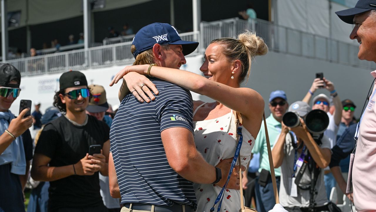 Jake Knapp and girlfriend, Makena White hug after the PGA Tour pro shot 59 at the 2025 Cognizant Classic