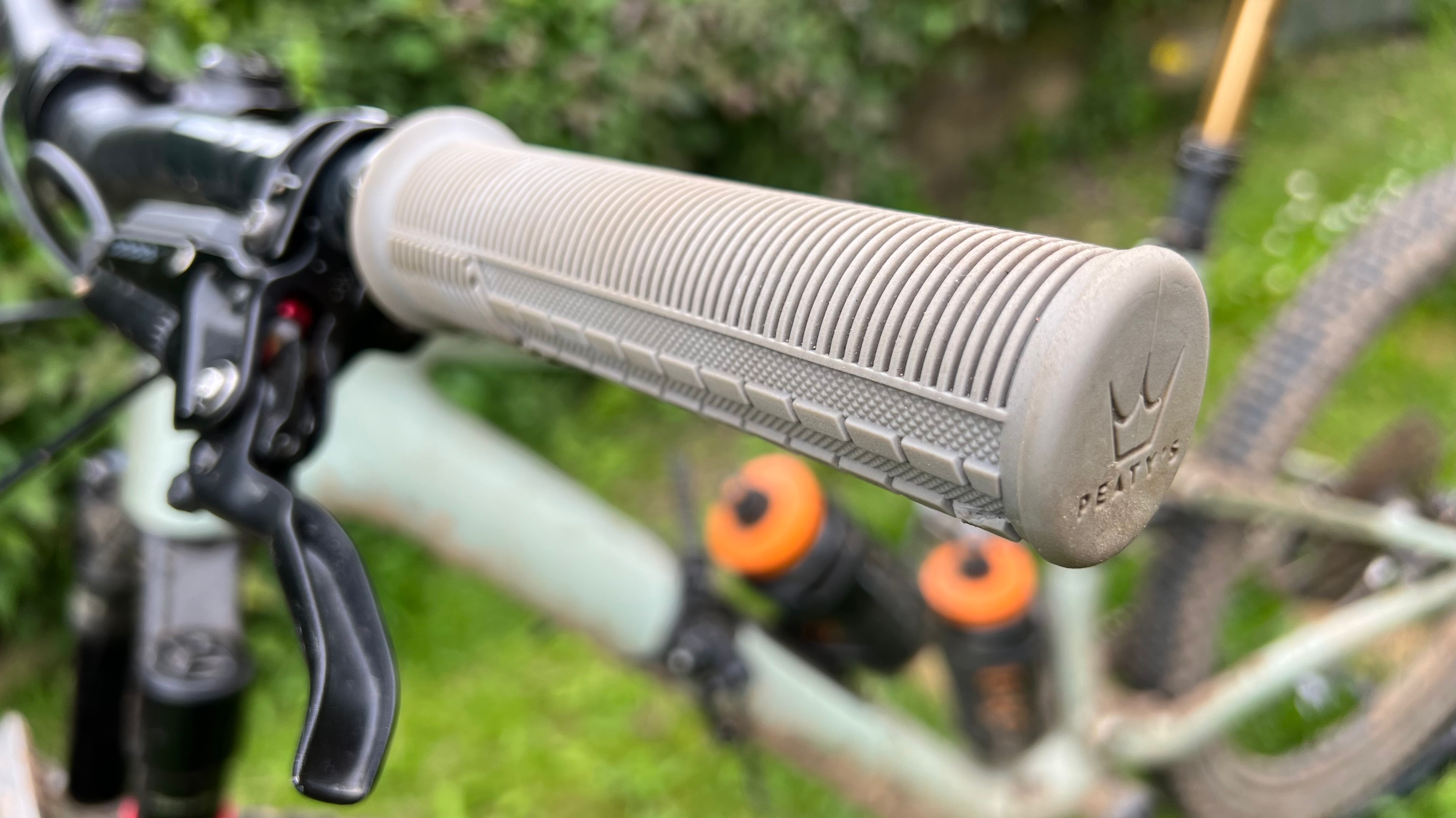 A Peaty's Monarch grip fitted to a handlebar on an MTB