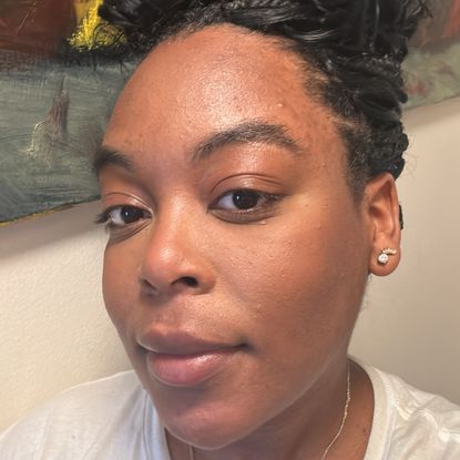 Ariel Baker testing Laura Mercier Secret Brightening Powder.