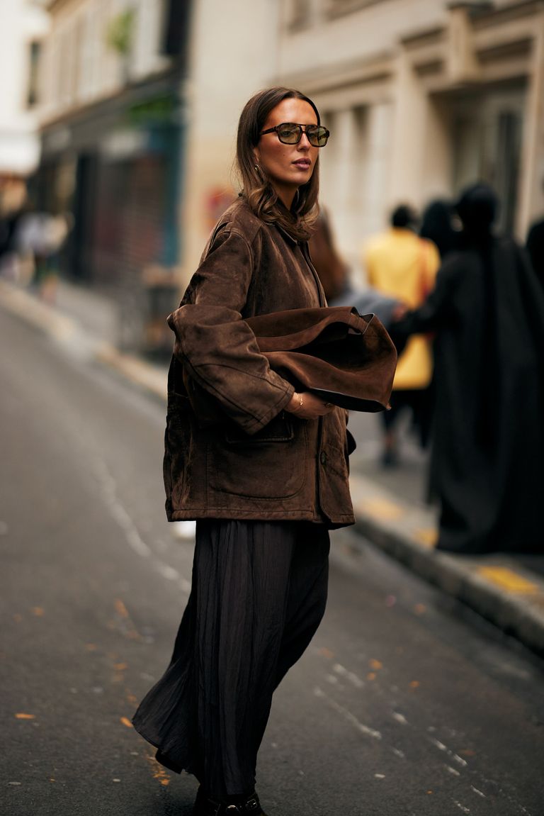street style image of suede handbag
