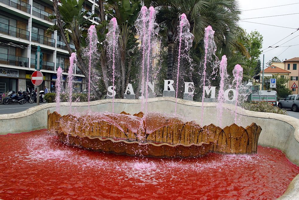 San Remo fountain water turned pink