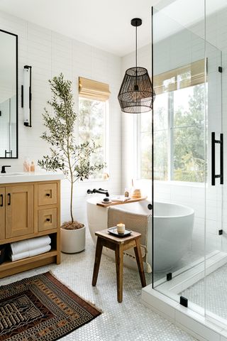 spa-like bathroom with white walls and indoor tree