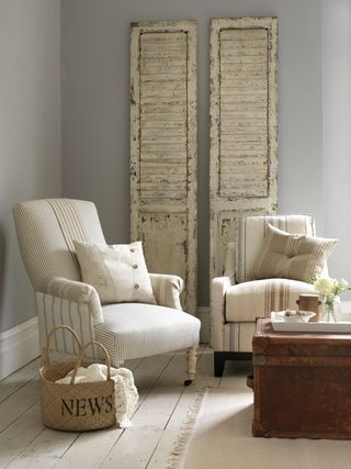 Living room with chairs upholstered in ticking fabric