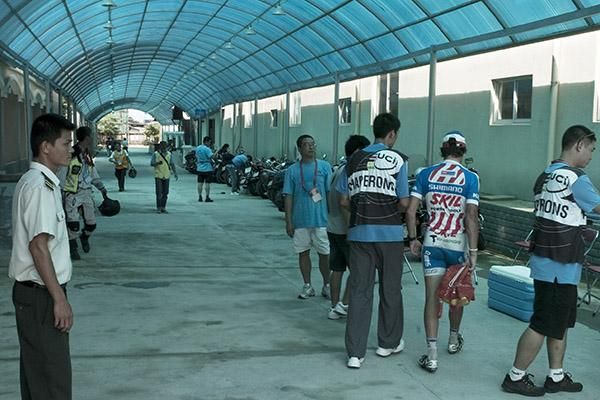 Stage winner Kenny Van Hummel (Skil-Shimano) is escorted to the anti-doping area at the back of the podium in Wenchang.