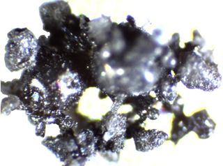 Another agglutinate by Off Planet Research, made from anorthosite feedstock and meant to mimic the properties of regolith found on the moon.