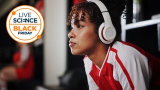 A Live Science Black Friday logo and a picture of a young woman sitting in a changing room with headphones on