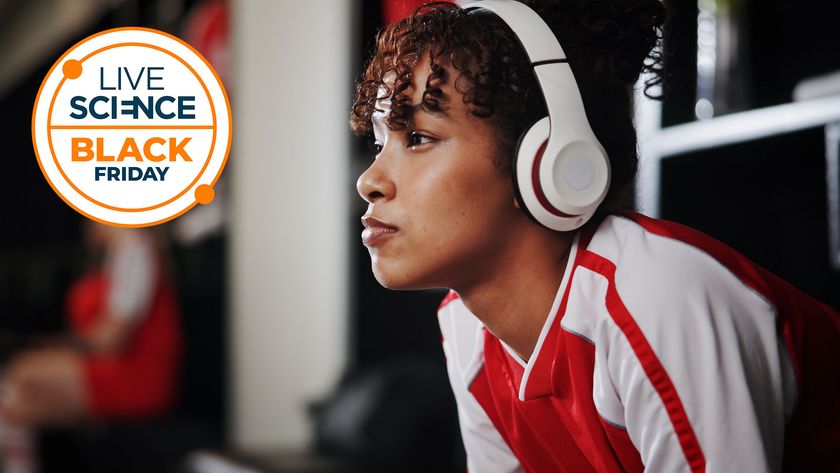 A Live Science Black Friday logo and a picture of a young woman sitting in a changing room with headphones on
