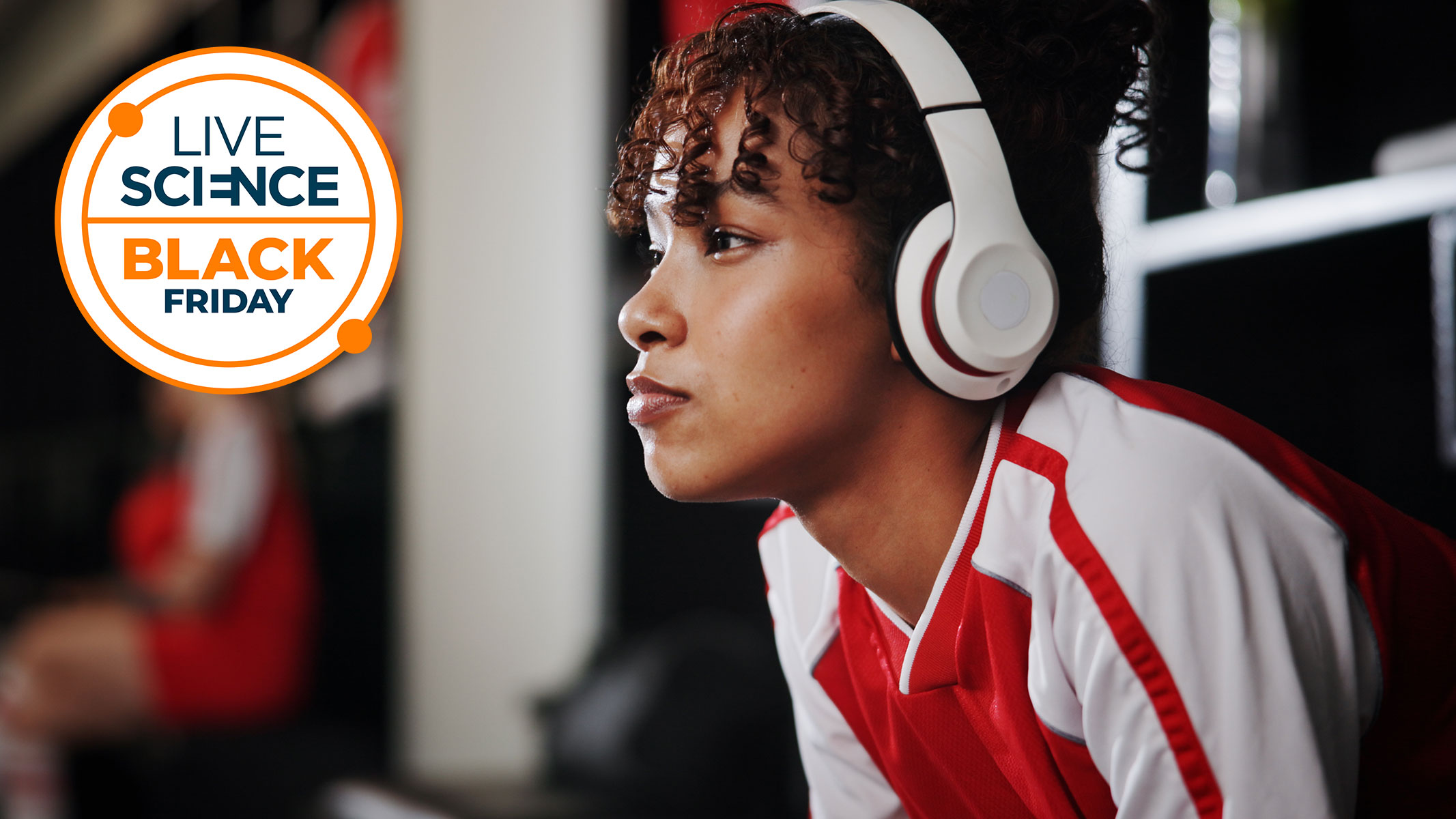 A Live Science Black Friday logo and a picture of a young woman sitting in a changing room with headphones on