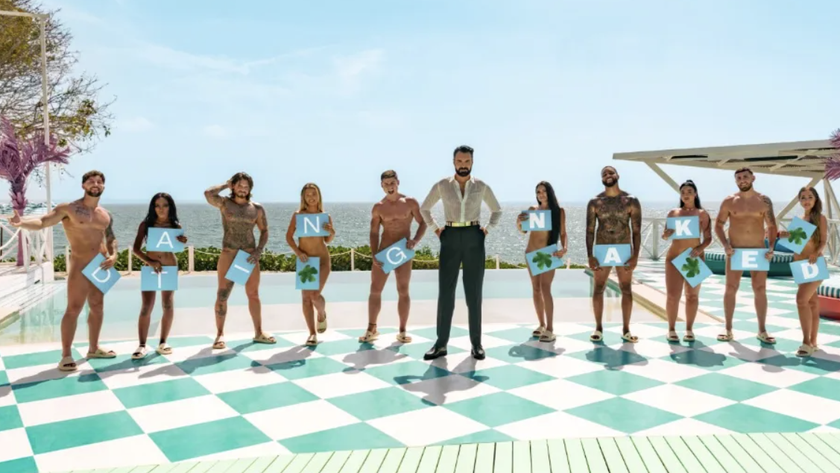 Rylan Clark and the cast pose poolside, covering themselves up with cards in Dating Naked UK