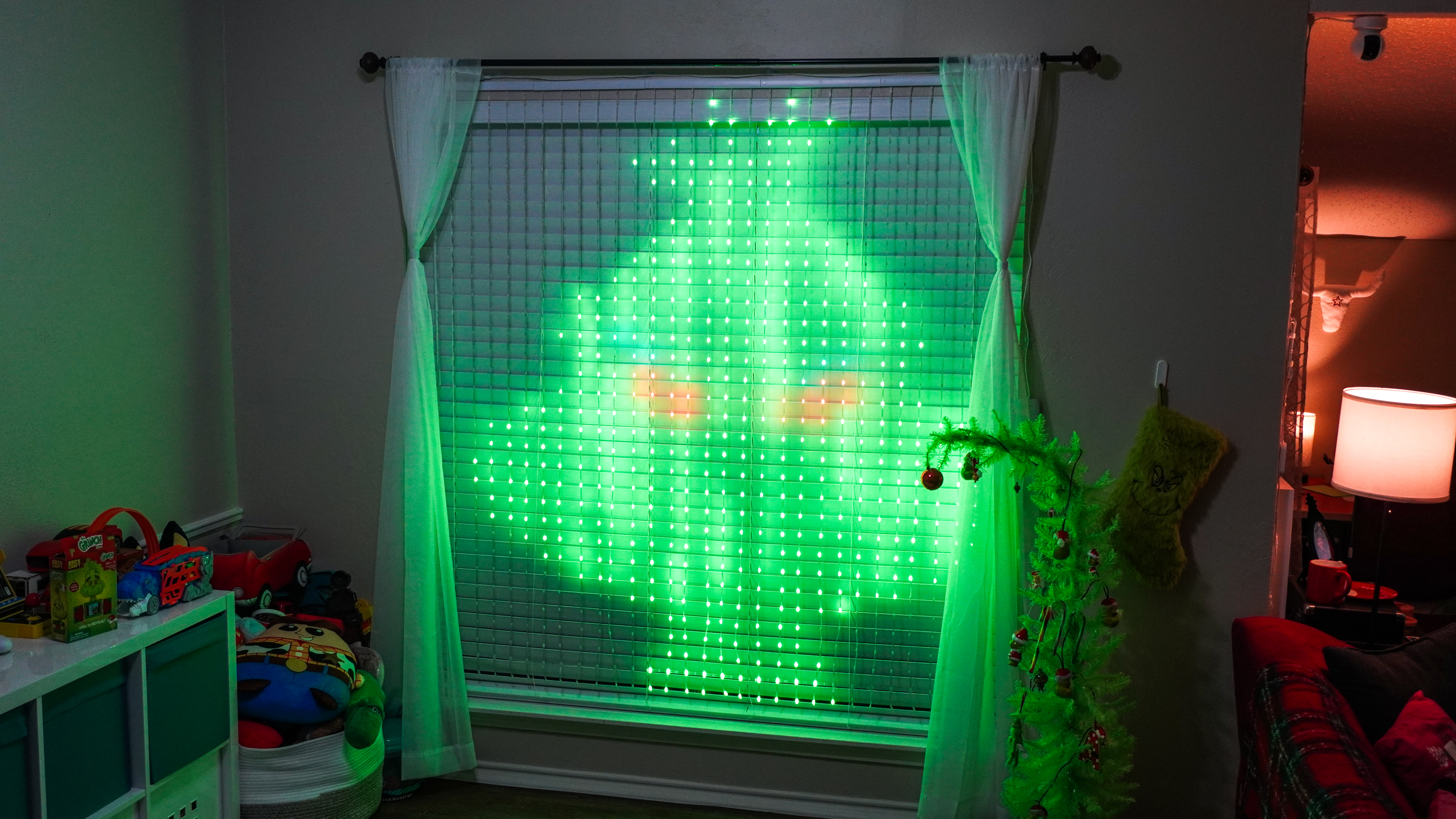 Govee's Curtain Lights Pro displaying a picture of the Grinch made using the company's AI-powered Lighting Bot