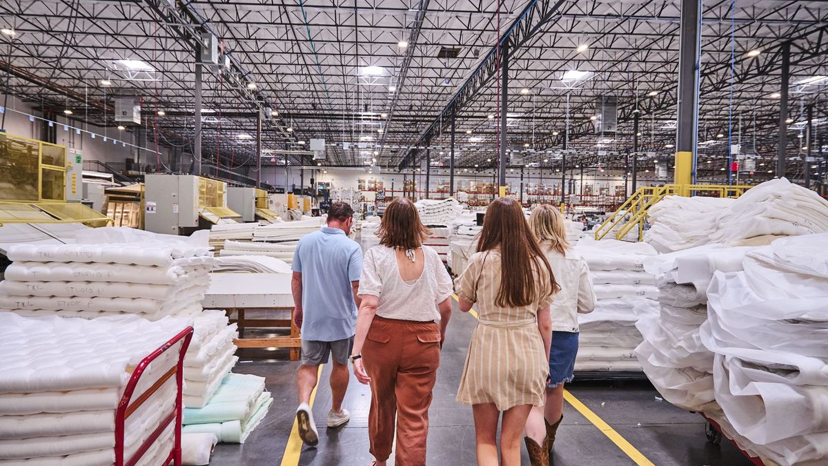 The tom&#039;s Guide mattress testers walking through the 3z mattress factory