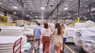 The tom's Guide mattress testers walking through the 3z mattress factory