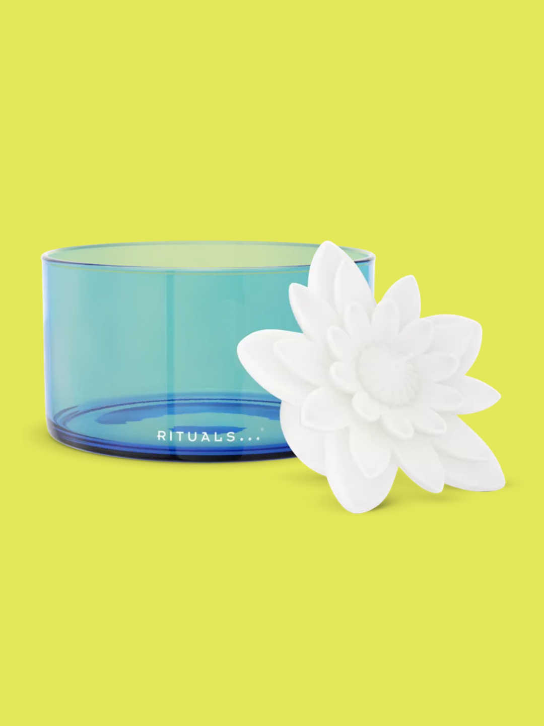 A lotus floating scented candle and a blue bowl