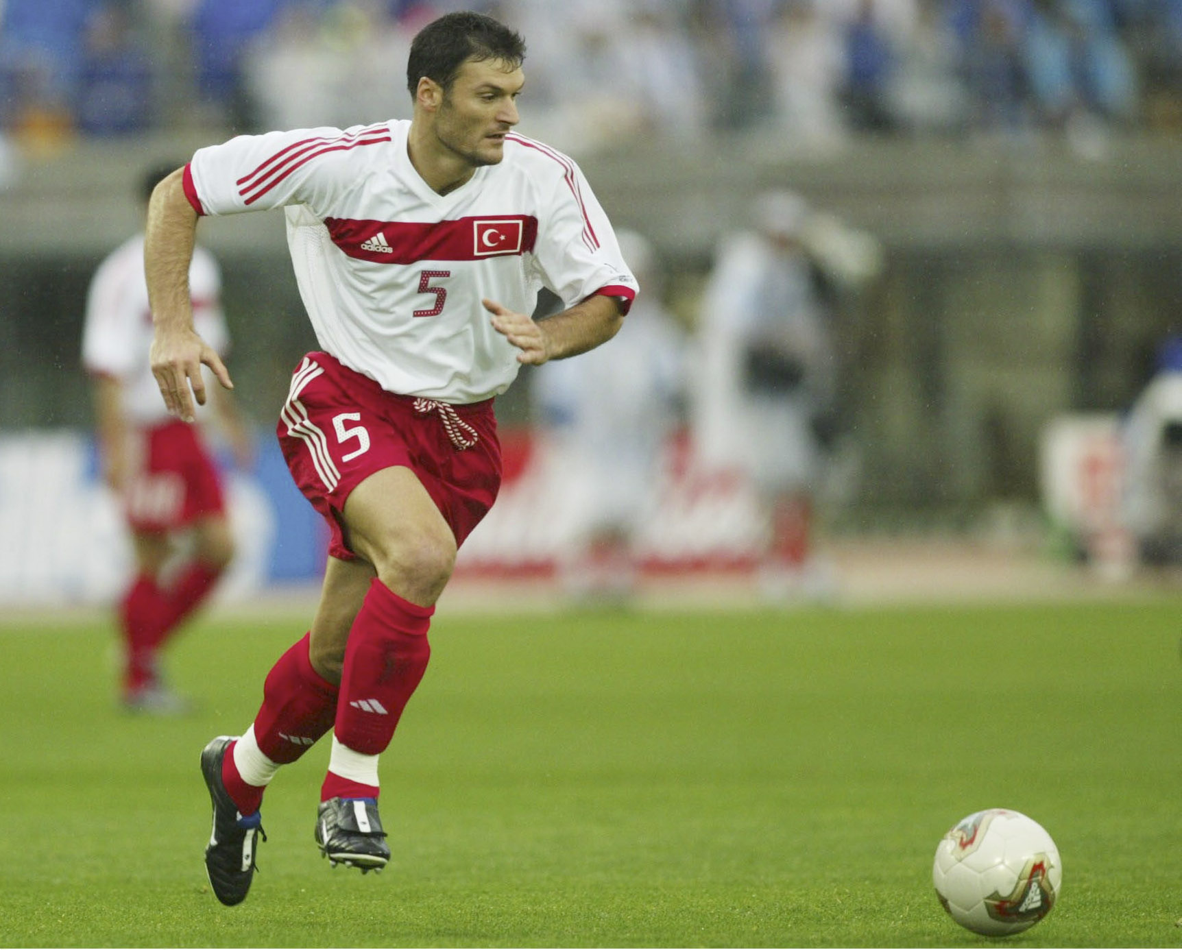 Turkey's Alpay Özalan in action against Japan at the 2002 World Cup.