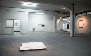 The work is liberally spread out across VOLKS’ stark grey concrete space