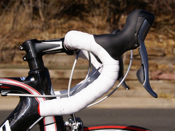 We were at odds with the handlebar bend until we moved the levers down to a more reasonable position.