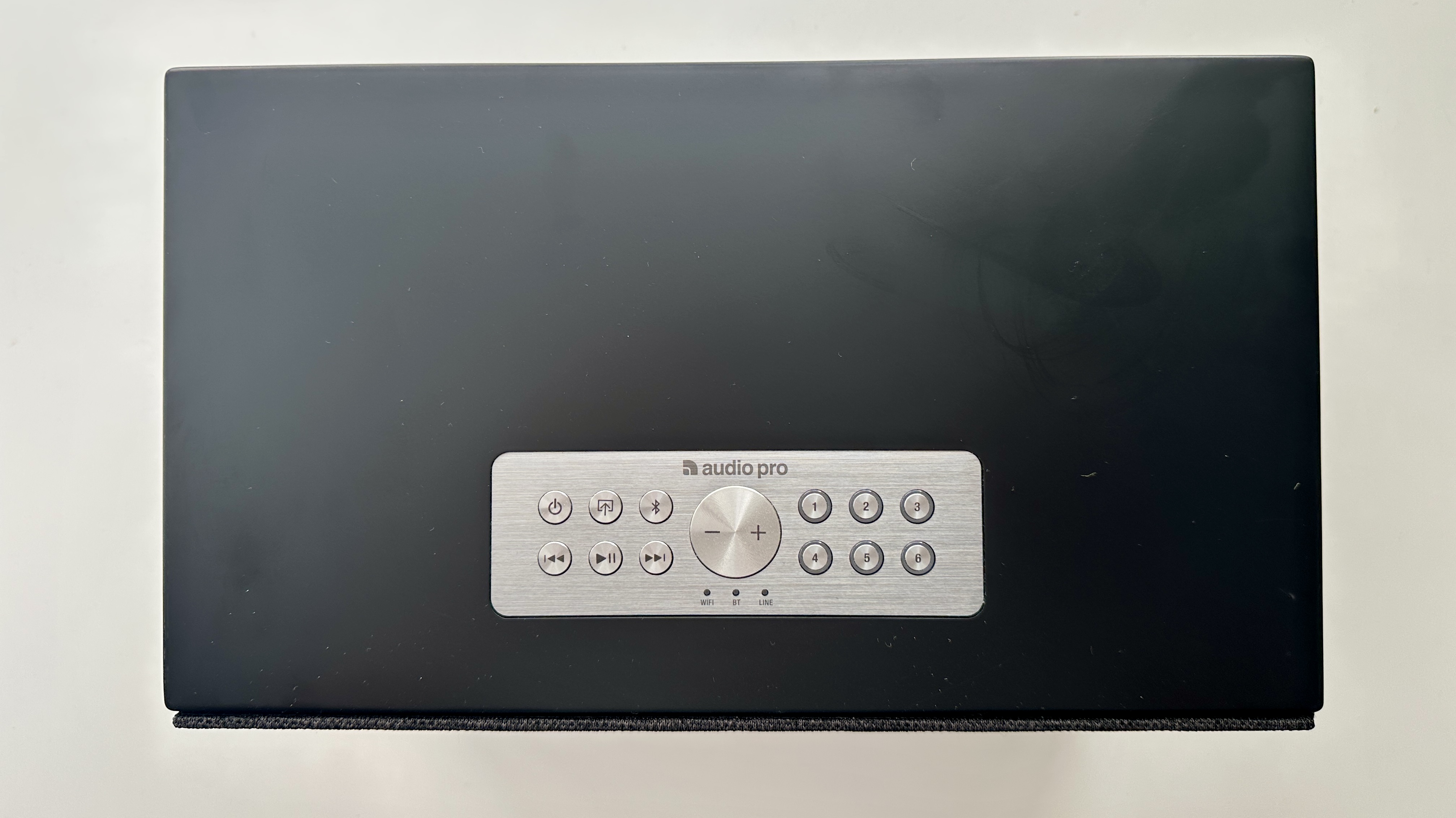Top panel of the Audio Pro Addon C10 MkII wireless speakers, on a white surface