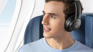 A person wearing a pair of wireless headphones