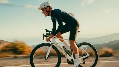 Image shows cyclist riding the Orbea Gain e-road bike