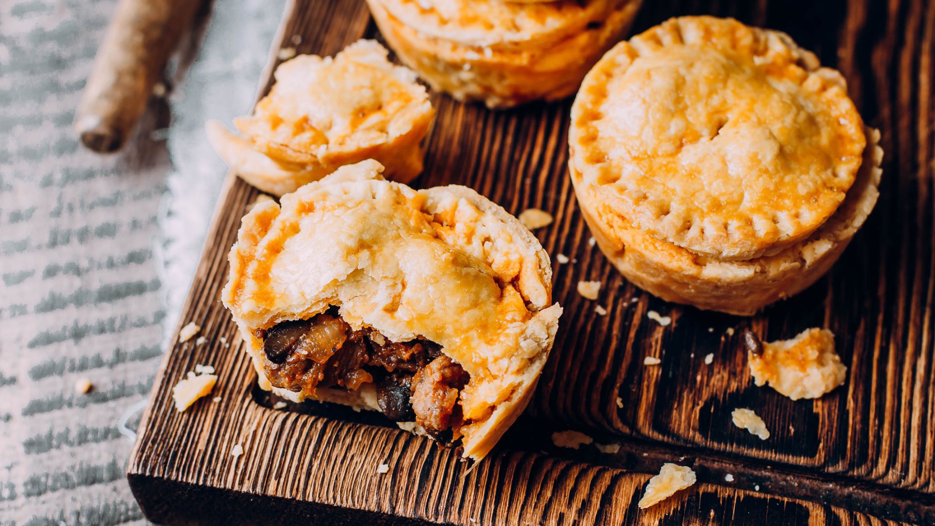 A board full of meat pies