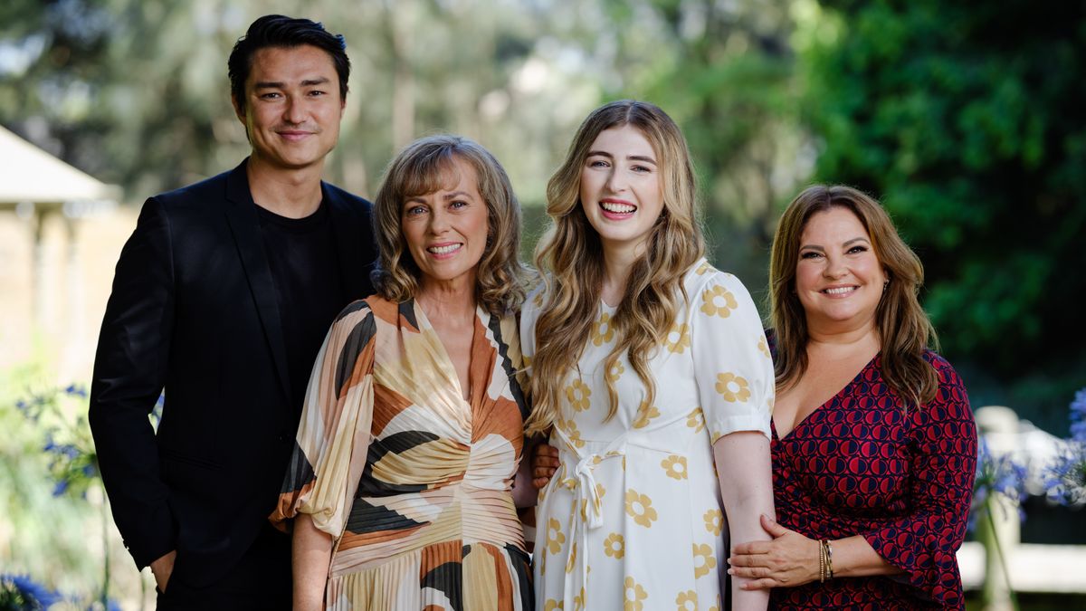 Neighbours cast Tim Kano, Annie Jones, Georgie Stone &amp; Rebekah Elmaloglou standing in a line, smiling. 