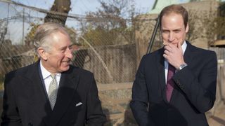 Prince William and Prince Charles smile as they attend a meeting of 'United for Wildlife'
