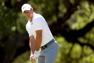 Rory McIlroy aims and gets ready to hit a tee shot