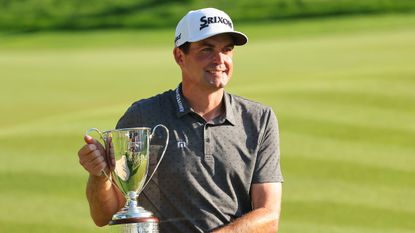 Keegan Bradley with the Travelers Championship trophy