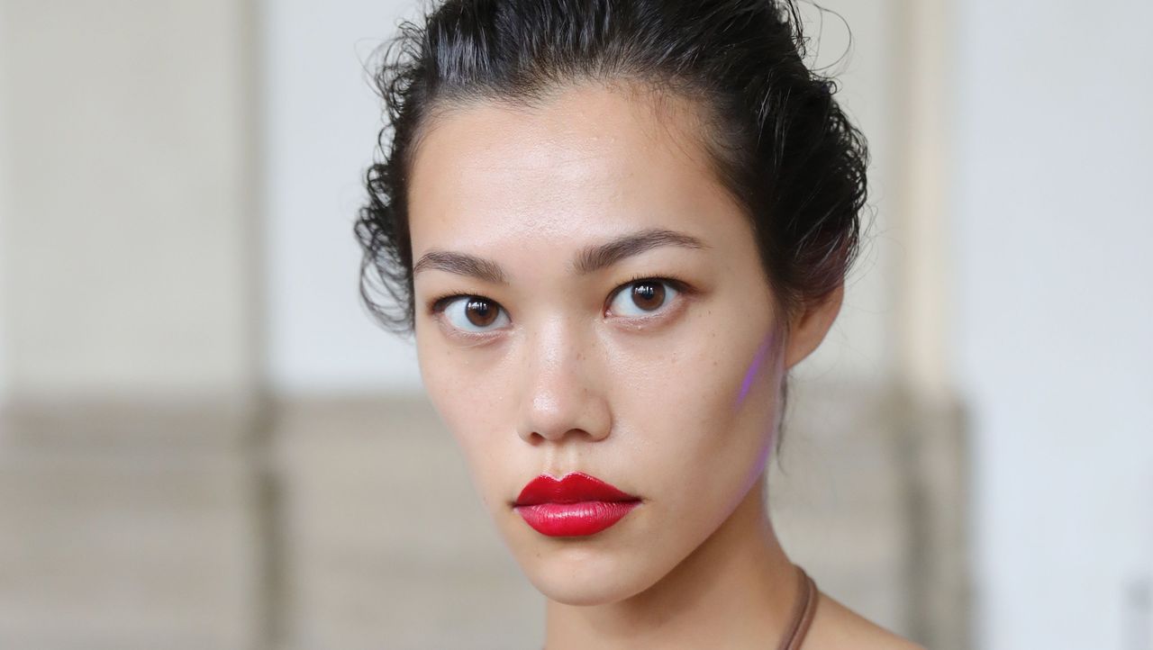 Woman wearing bright red lipstick