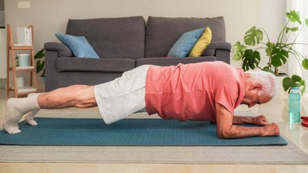 senior man doing a plank