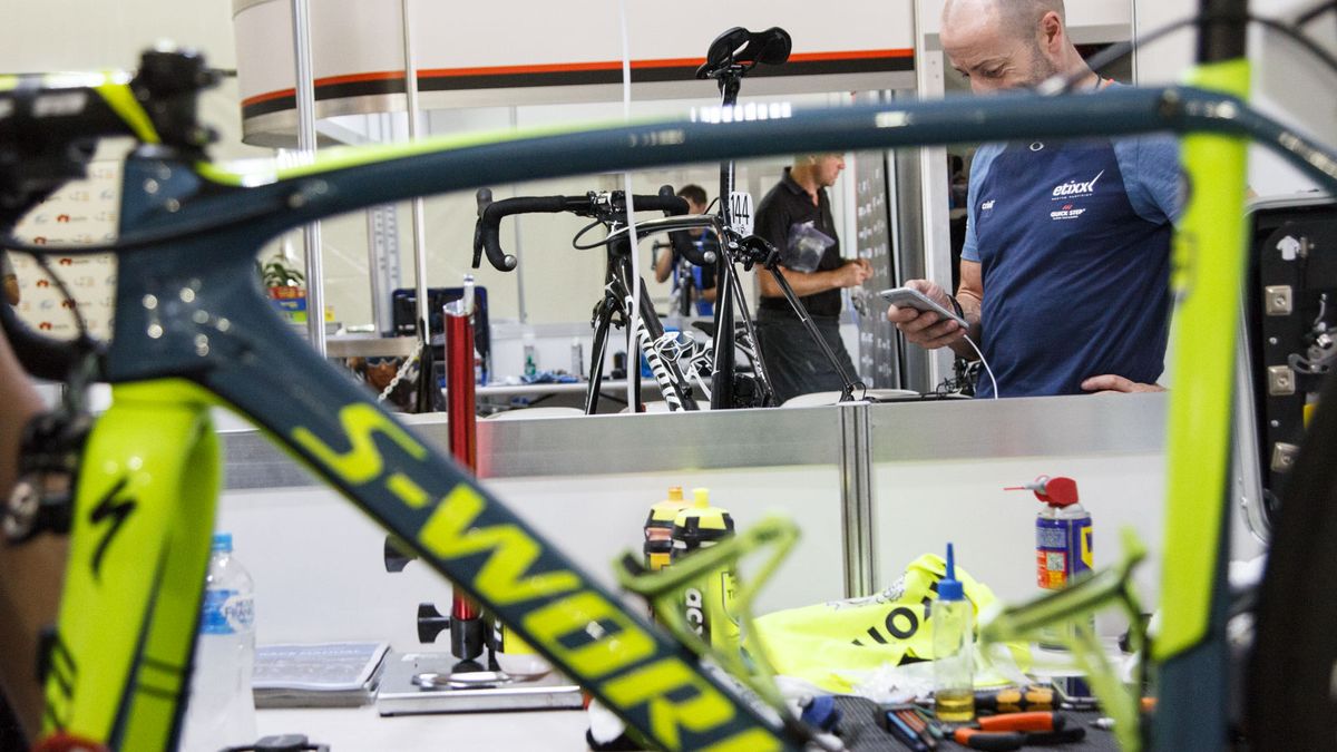 The Tour Down Under mechanics pits are unique in terms of public access and how close all the teams are next to each other