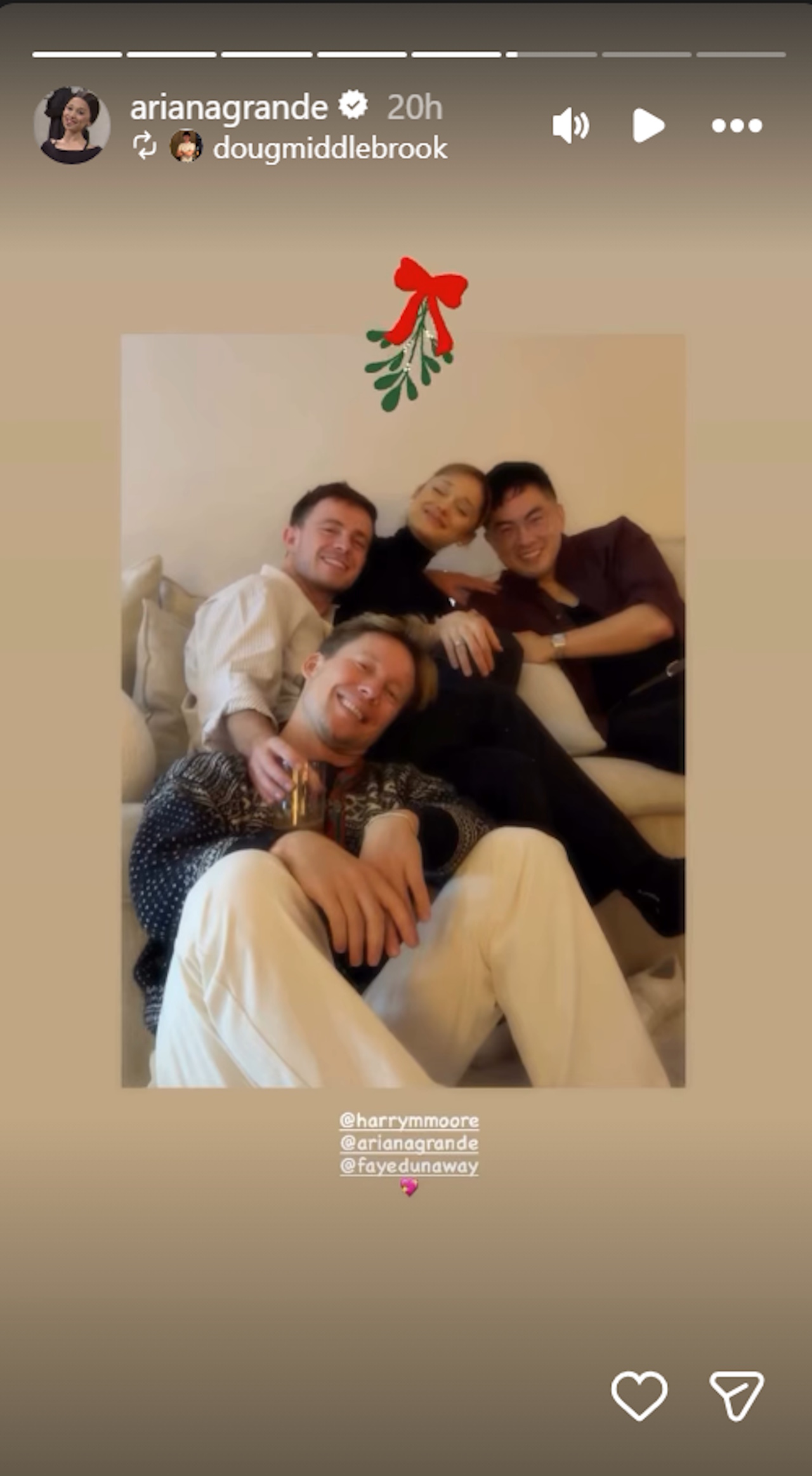 Ariana Grande shares a photo of her and Ethan Slater's Christmas with buddies including their Wicked co-star Bowen Yang.