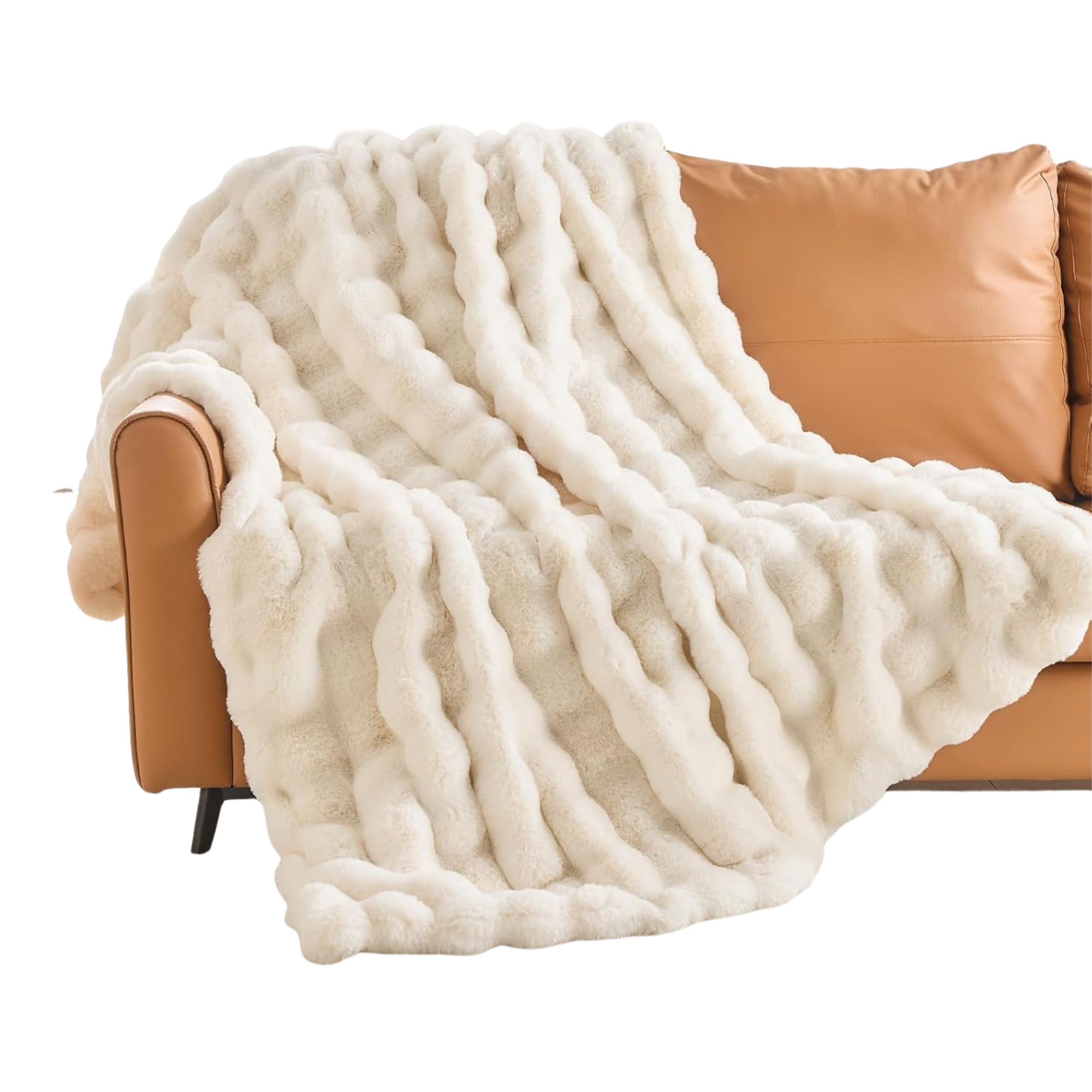Fluffy white throw on a tan leather sofa