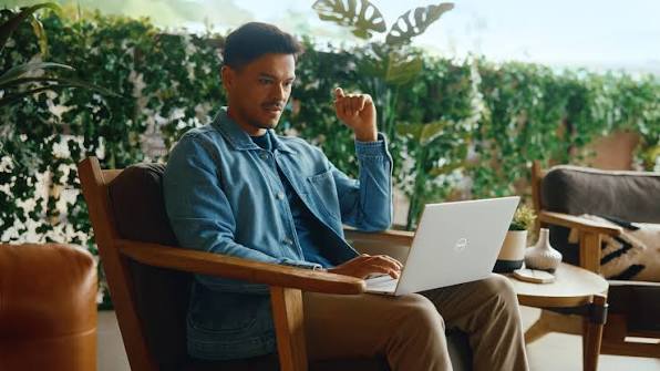 A man working on a Dell XPS 13 Laptop