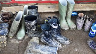 Muddy hiking boots and rain boots