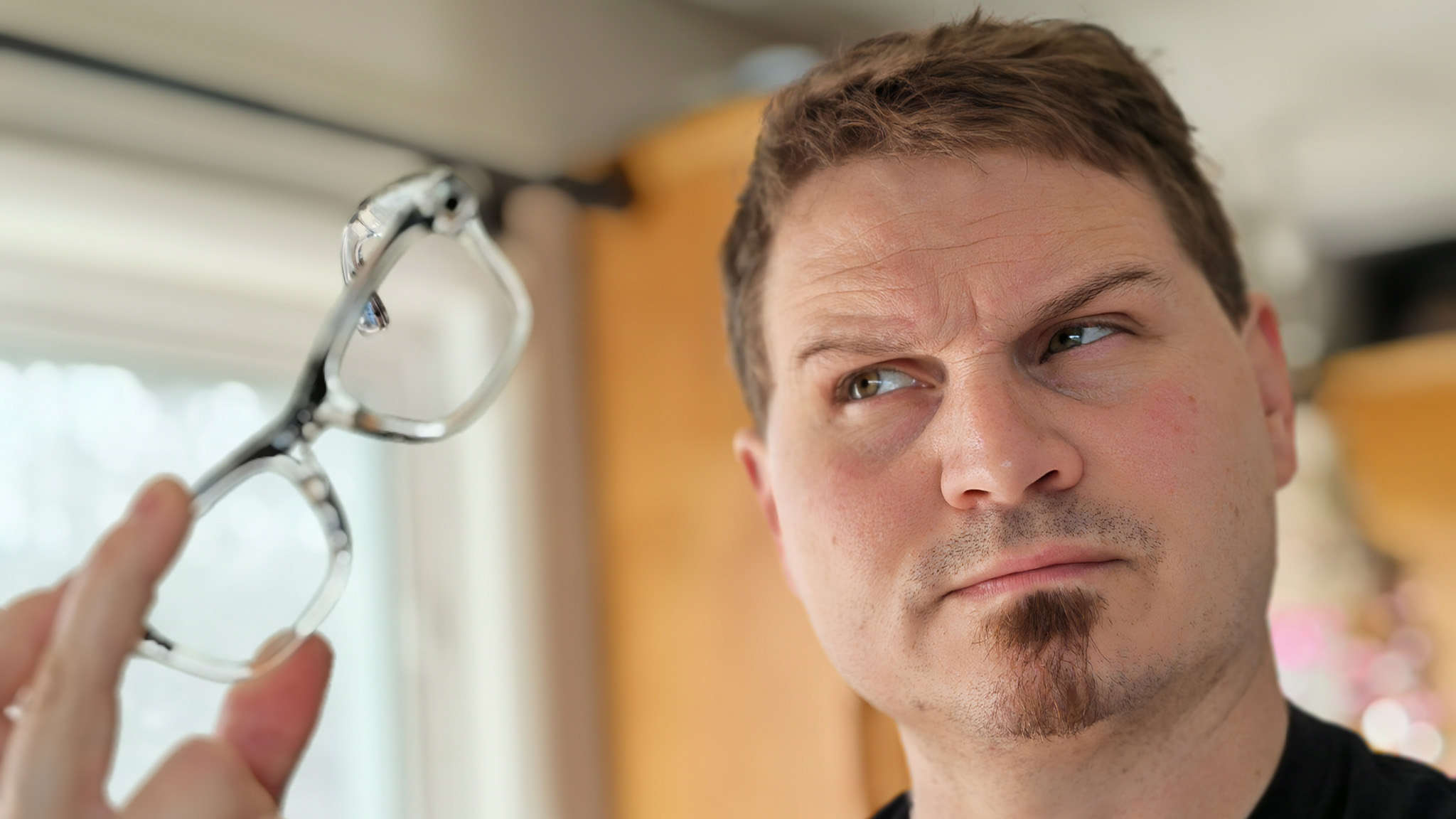 Looking at a pair of transparent Ray-Ban Meta Smart Glasses with uncertainty