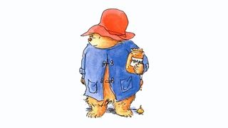 Illustration of Paddington bear dressed in a blue coat and red hat, holding a jar of marmalade