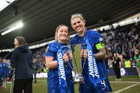 DERBY, ENGLAND - MARCH 15: Erin Cuthbert and Millie Bright of Chelsea celebrate with the trophy following their team's victory in the Subway Women's League Cup Final match between Chelsea and Manchester City at Pride Park on March 15, 2025 in Derby, England. 