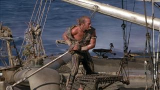 Kevin Costner on a boat in Waterworld