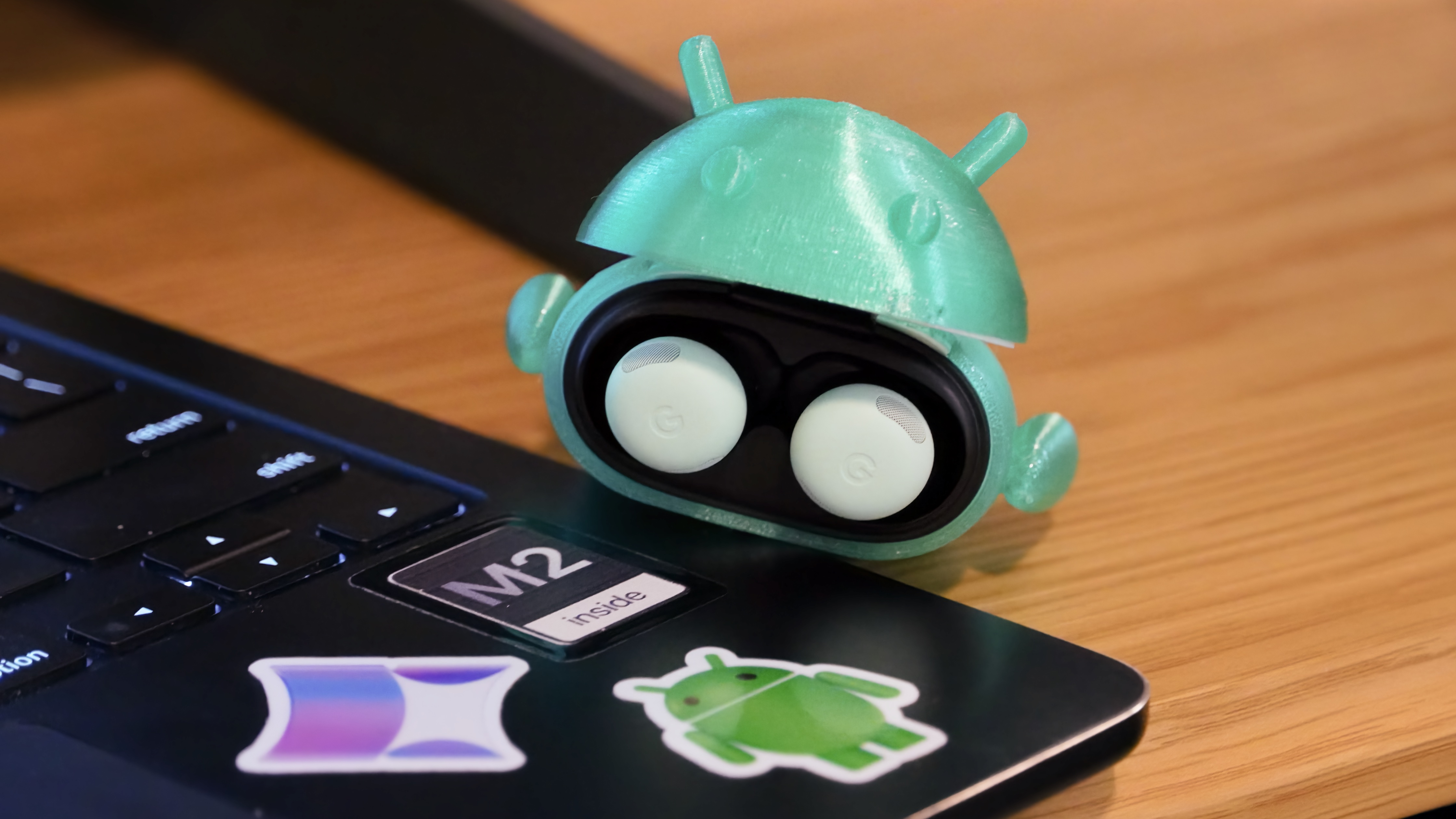 The Android Bot 3D-printed case on a pair of Google Pixel Buds Pro 2. 