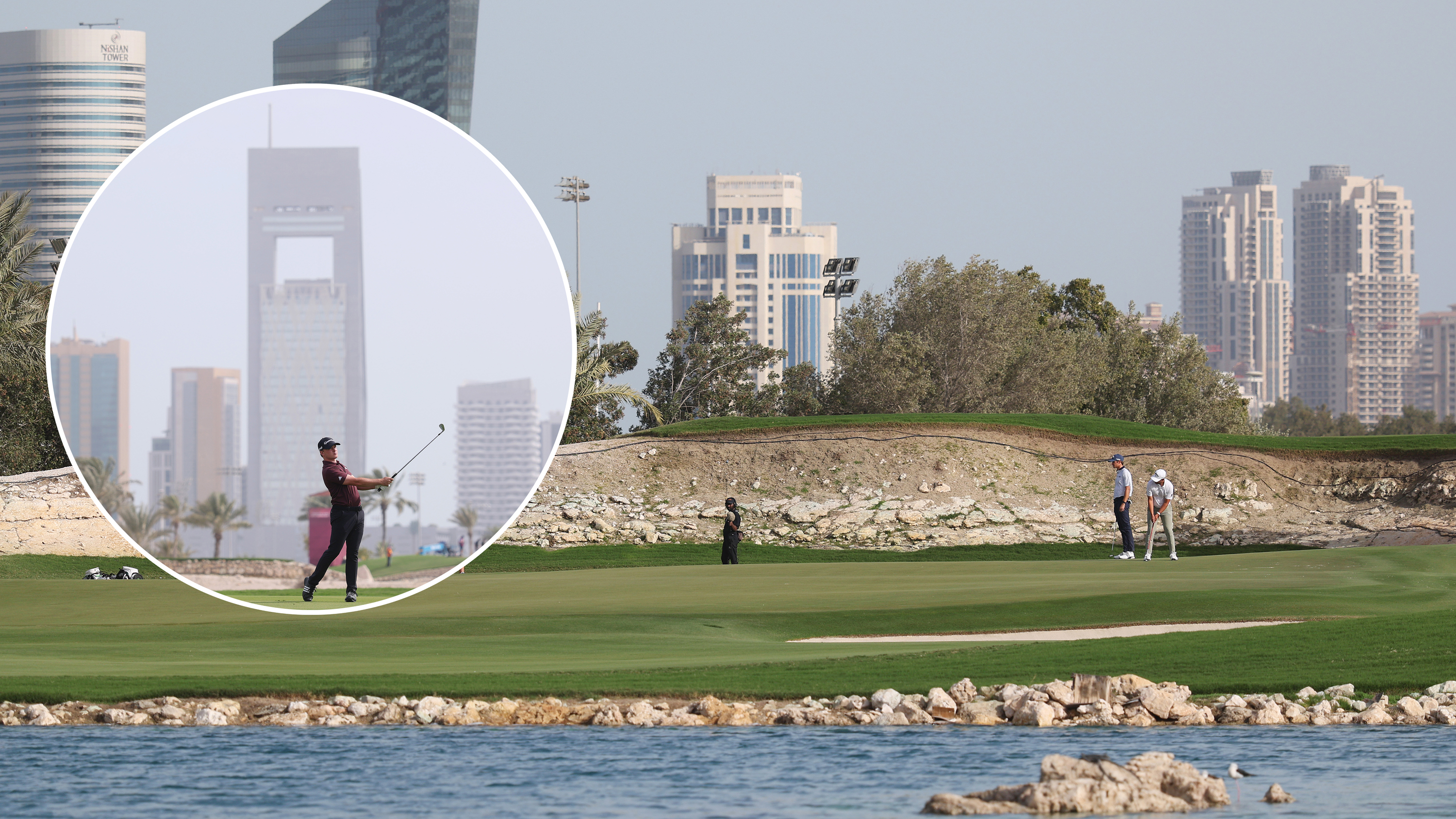 The Qatar Masters venue with golfers putting on the green, surrounded by water, and hitting an iron shot with backdrop of Doha behind