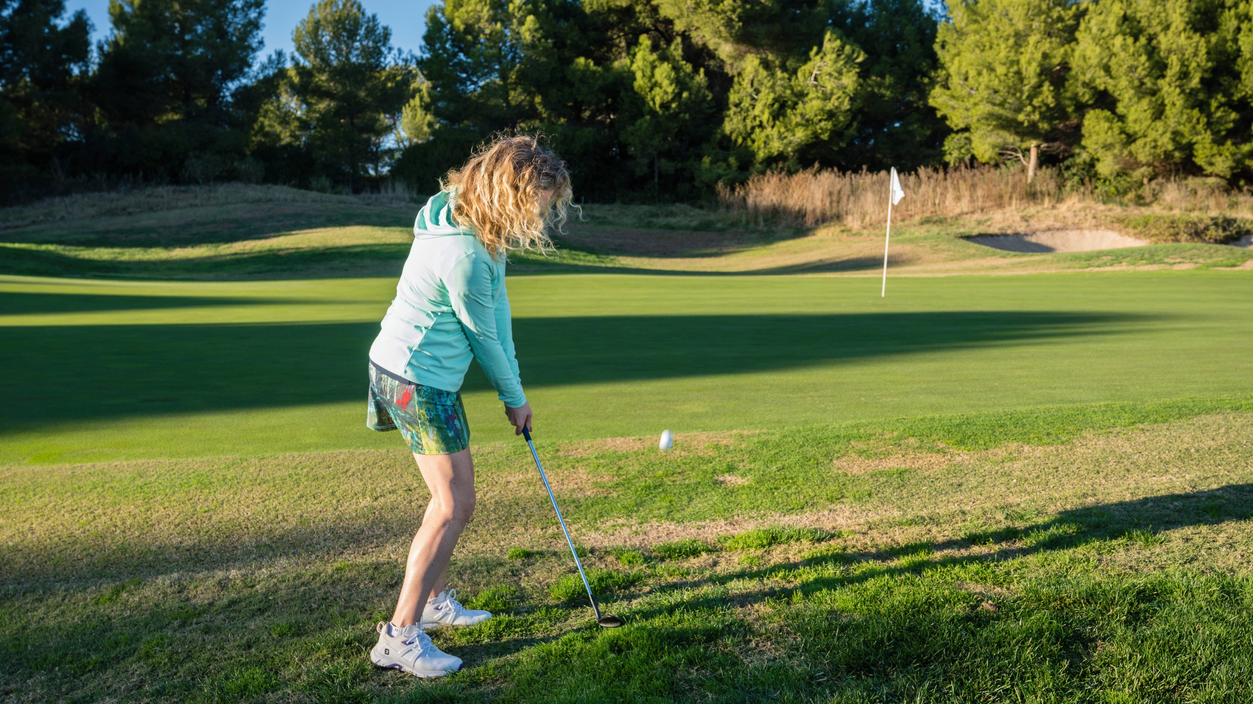 Katie Dawkins plays a chip shot