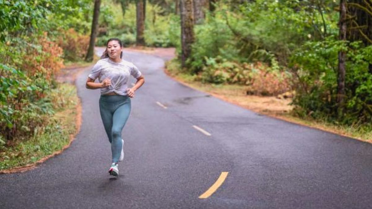 Woman running in Altra zero-drop shoes