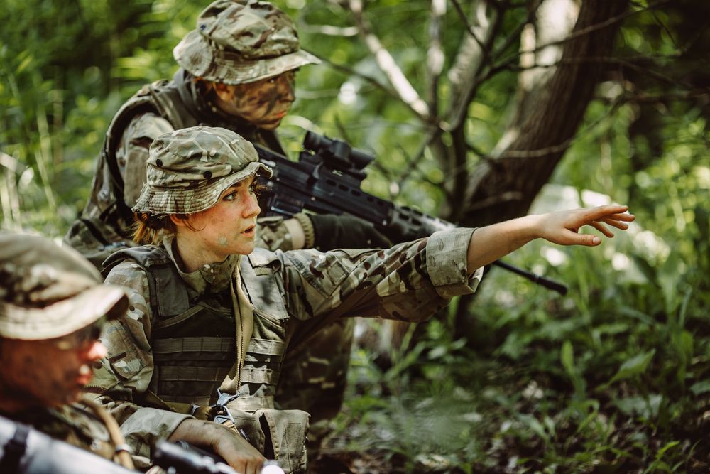 A soldier pointing during a military exercise