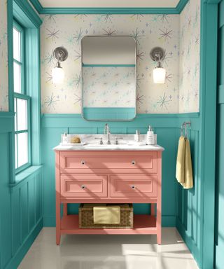 blue bathroom with pink freestanding under sink storage