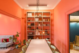 a bright orange dining room space