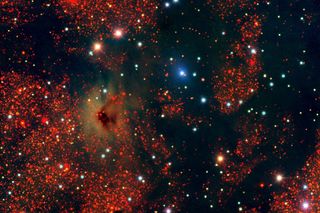 The dark regions show very dense dust clouds. The red stars tend to be reddened by dust, while the blue stars are in front of the dust clouds. These images are part of a survey of the southern galactic plane.