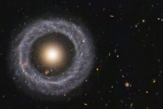 With a perfectly symmetrical ring circling a red sphere of stars, Hoag's object is one of the prettiest mysteries in the universe.