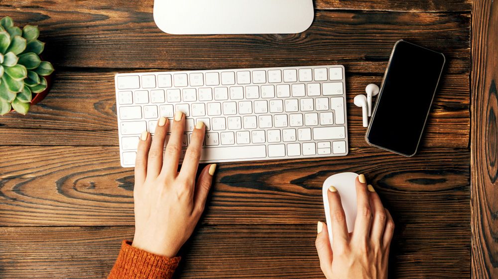 The Apple Magic Keyboard, here on a wooden desk, is one of the best keyboards we&#039;ve tested.