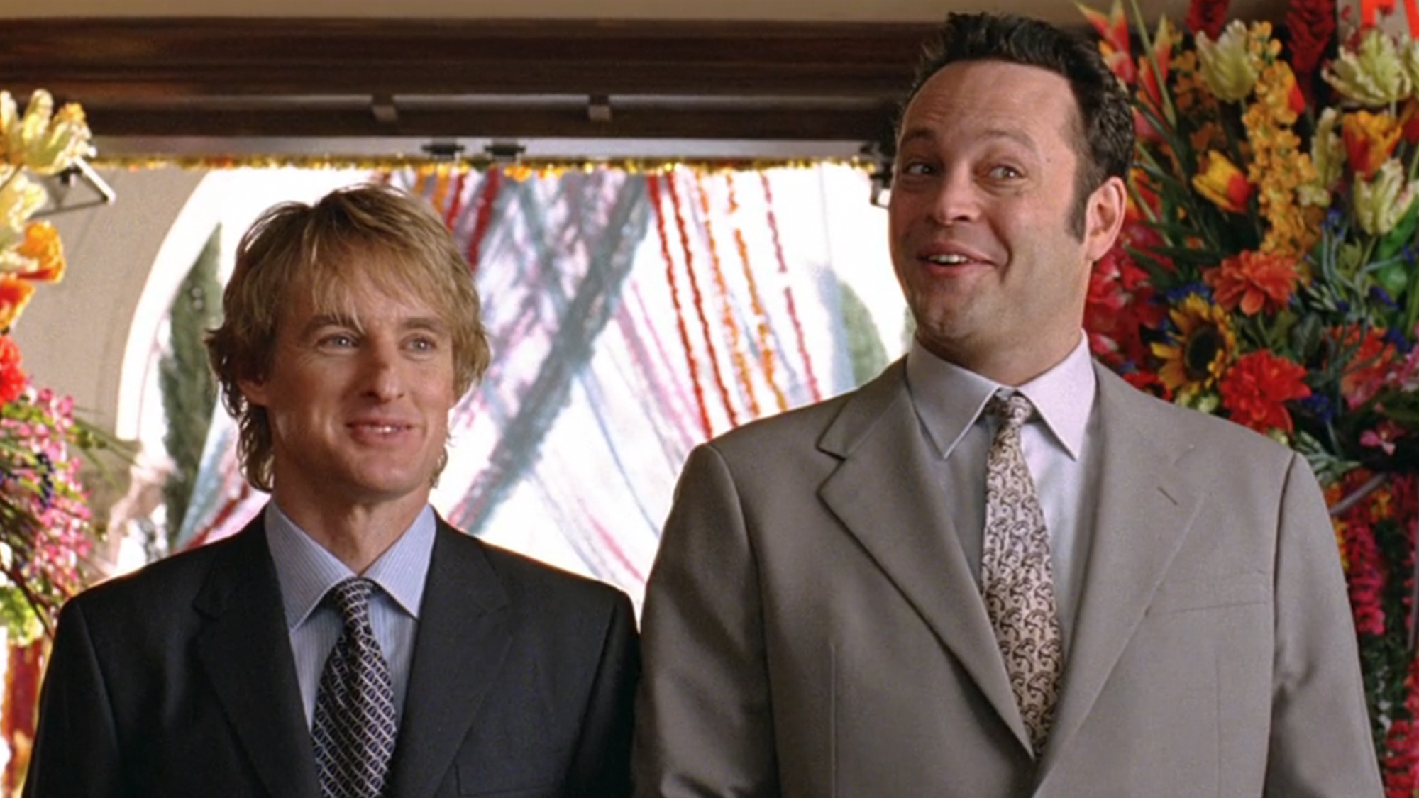 Owen Wilson on the left, smiling with Vince Vaughn on the right.